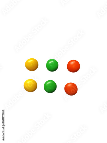 Cuadro en lienzo Colorful round candy pieces in small groups isolated on white background