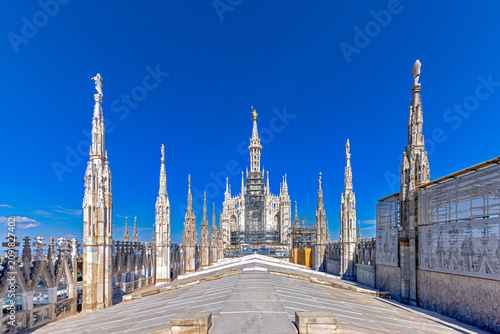 Obraz na plátně Duomo di Milano rooftop features the largest walkable Gothic roof in the world,