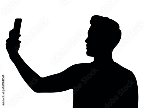 Obraz na plátne Silhouette of a man taking a self portrait with a smartphone black shape on a wh