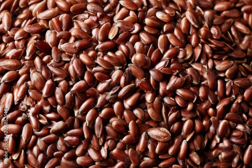 Flaxseed pile arranged in a dense organic pattern with macro sharp focus for health and nutrition marketing