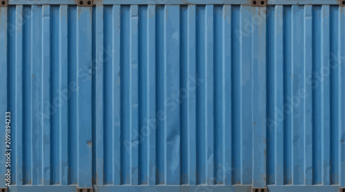 Industrial blue corrugated metal background with vertical ridges, seamless shipping container wall texture, weathered aluminum panel pattern, durable steel facade surface for urban design.