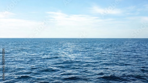 Vast blue ocean under clear sky