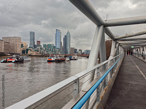 photographing the City from a bridge next to the River Thames, London, Great Britain