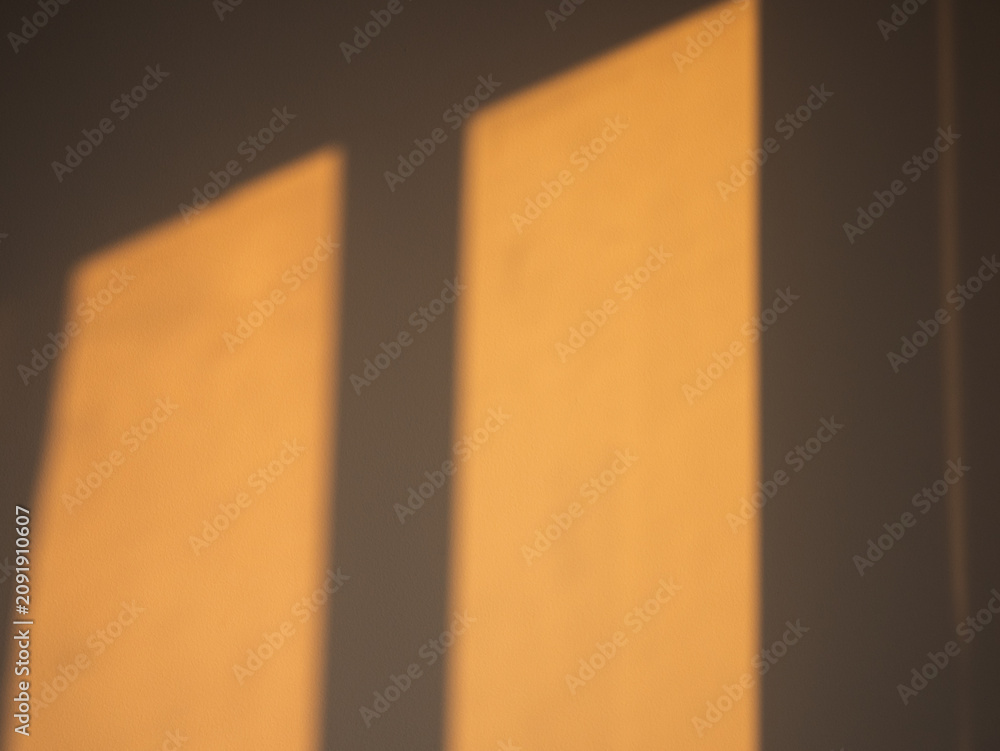 Ταπετσαρία Warm golden sunset window light casting abstract geometric shadows on bright int