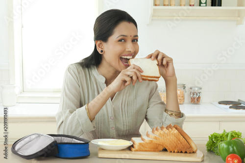 Woman eating bread
