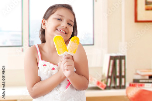 Girl eating ice cream popsickles