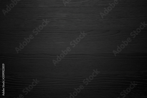 Dark black wooden surface background texture with subtle grain lines