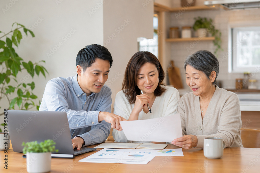 Fototapeta premium Family Reviewing Household Budget Together