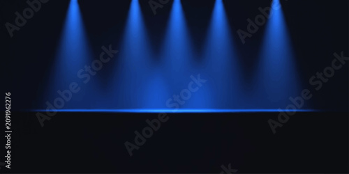 Foto Four bright blue spotlights illuminate a dark stage, creating a dramatic atmosphere perfect for performances or presentations