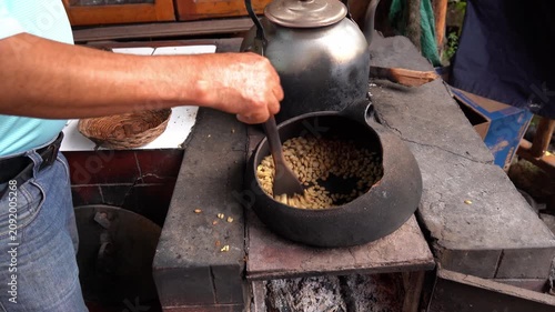 Traditional roasting of green coffee beans over fire
