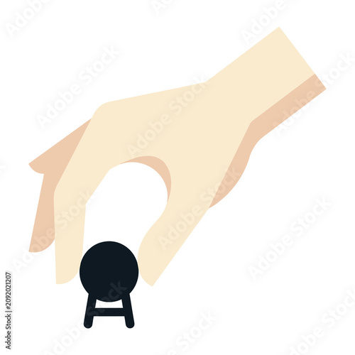 Human hand picking up a small black circular object isolated on white background