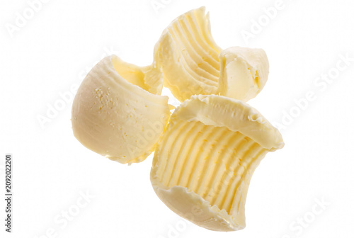 Fotografie Three Pale Yellow Butter Curls with Ridged Texture