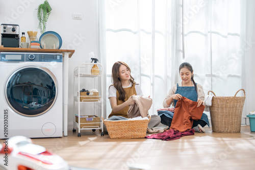 Fotografie Laundry woman basket clothing home washing machine bright indoor fabric clean, t