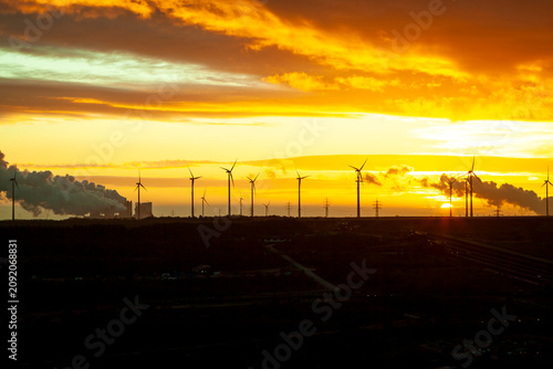 Garzweiler brown coal mining at sunrise with wind park in the background, Juechen, Germany