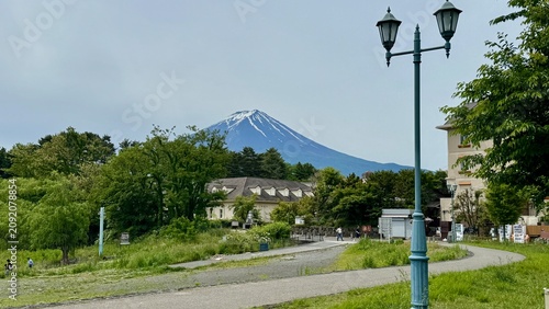 Street Lamp and Curving Road With Mount Fuji in the Distance