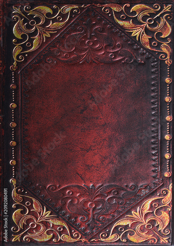 Vintage decorative book cover with ornate red and gold floral design