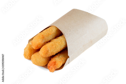 Crispy fried cheese stick in craft paper pocket on white background side view close up with copy space delicious savory snack food for take out