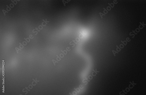 Fotografie Mysterious glowing orb in a dark and cloudy atmosphere