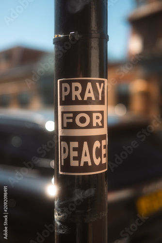 Canvas Print Pray for Peace Sticker on Street Pole in Chiswick London