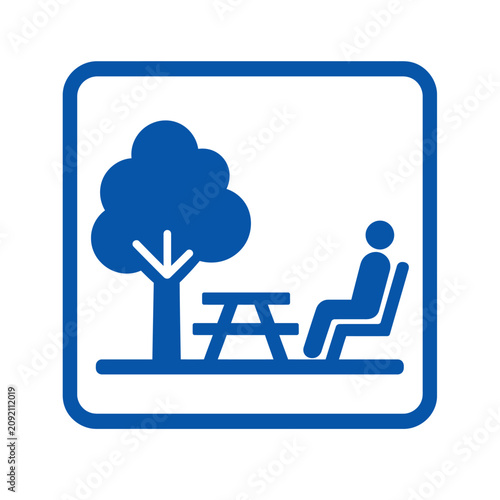 Photography Blue picnic area sign with tree and bench icon.