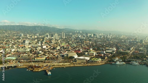 Cebu city overview: seaport with ships and ferries. Capital city of the province of Cebu and is the second city of the Philippines after Metro Manila during sunrise.
