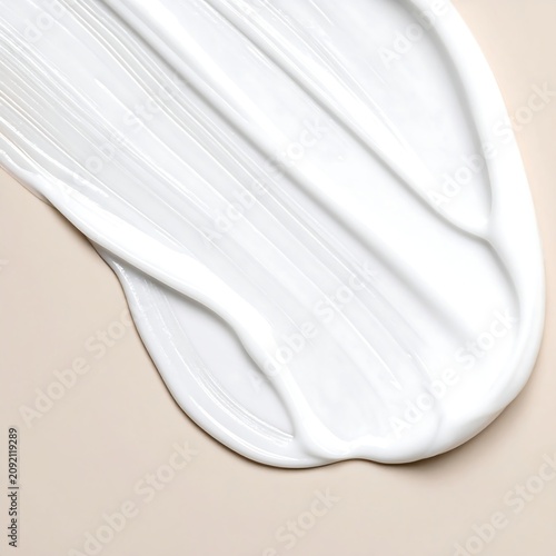 Smooth White Cream Smear Spread on Soft Beige Background