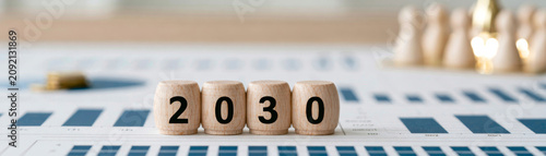 Business roadmap futuristic business vision for 2030 with wooden blocks on financial chart, symbolizing planning, growth, and future strategy in corporate environment