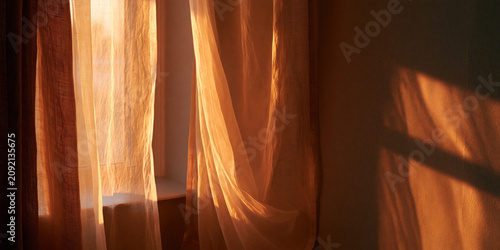 Soft Light Streaming Through Drape Curtains in Interior