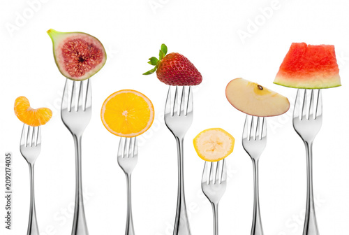 фотографія Assorted Fresh Fruit Slices Impaled on Silver Forks