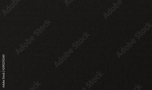 a dark black textured paper background. The matte surface features subtle horizontal and vertical fiber patterns, simulating premium cardstock or canvas