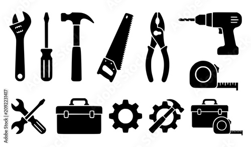 Black silhouette tool set wrenches hammers saws drills and measuring tools
