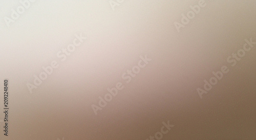 Foto A largely indistinct blurry image featuring a predominantly beige and pale pink