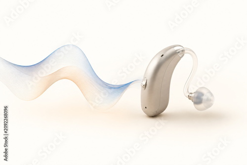 Modern Hearing Aid with Abstract Sound Wave on Clean Background, Hearing Technology Concept