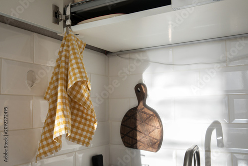 Obraz na plátne A kitchen towel hangs on a dish rack.