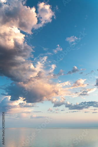 Colorful sunrise over the sea  with orange clouds.