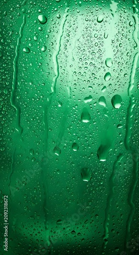 Abstract Green Background With Water Droplets And Streaks.