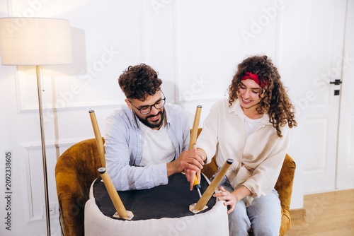 Obraz na plátně Couple assembling furniture together, improving their home