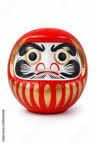 Red daruma doll on white background traditional Japanese lucky charm