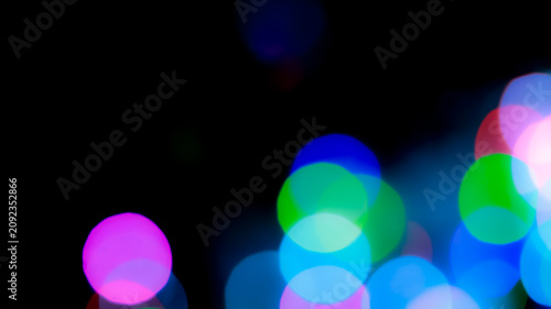 Fotografía Abstract colorful bokeh lights background with vivid blue green and pink spheres