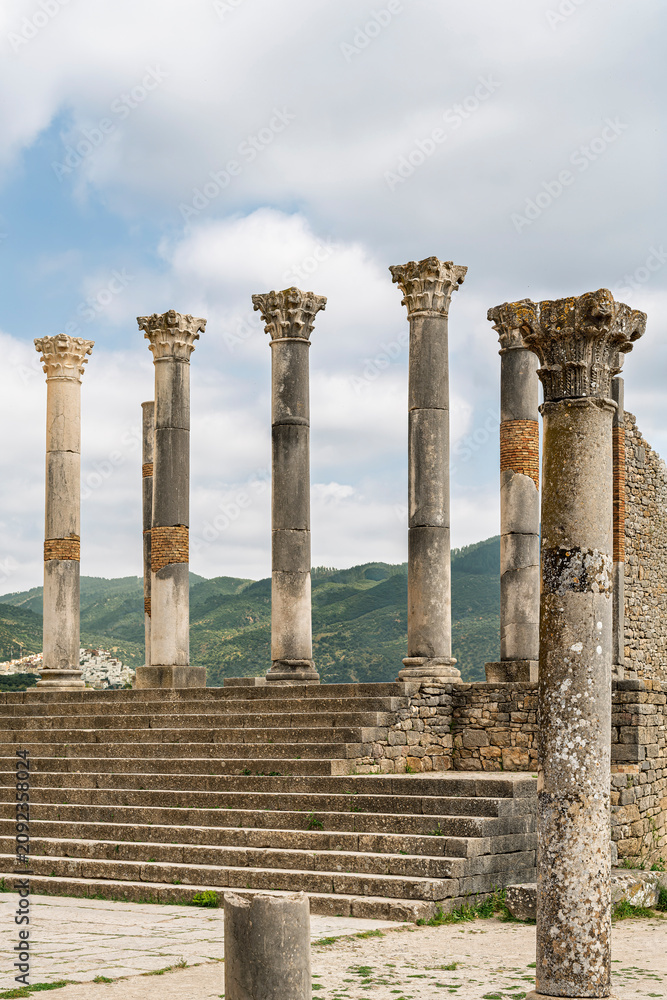 Fototapeta premium Columns and Steps Seen from Below at the Capitol, Volubilis, Morocco