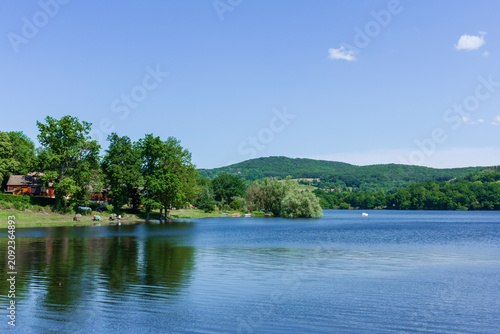 Obraz na płótnie Lake surrounded by forest in summer, Lac de Panneciere, Panneciere Lake in Morva