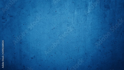 Abstract blue concrete wall texture background with scratches and spots