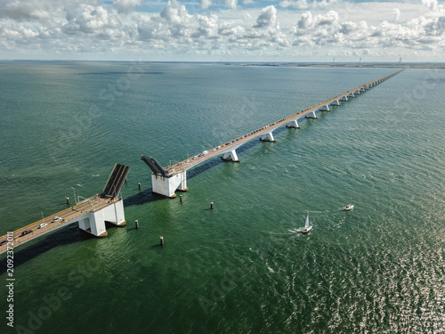 Cuadro en lienzo Zeeland Bridge bascule span closing after sailboats crossing Oosterschelde water