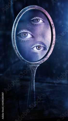 Surreal mirror reflecting multiple human eyes in a dark setting.