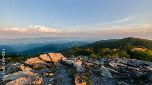 A dramatic sunset viewed from Spruce Knob West Virginia in the Appalachian Mountains looking down on hills in the surrounding valleys