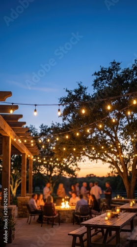 Friends enjoying an evening gathering around a fire pit in a landscaped backyard. Outdoor entertaining, summer celebration, cozy lifestyle, community connection.