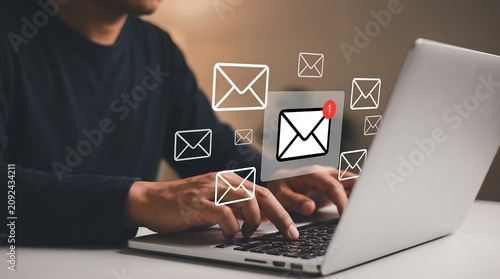 Professional Using Laptop Computer Receiving Multiple Digital Email Notifications and Messages for Efficient Remote Communication and Business Networking