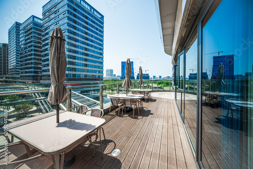 Modern Outdoor Dining Area Showcasing Urban Life and Stylish Architecture