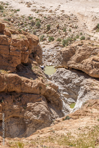 Looking down on two small pools of water near Nahal Rahaf-Rahaf Stream in the Judean Desert in Israel.
