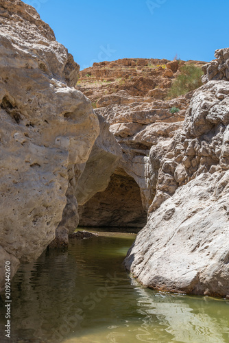 A pool of water near Nahal Rahaf-Rahaf Stream in the Judean Desert in Israel.
